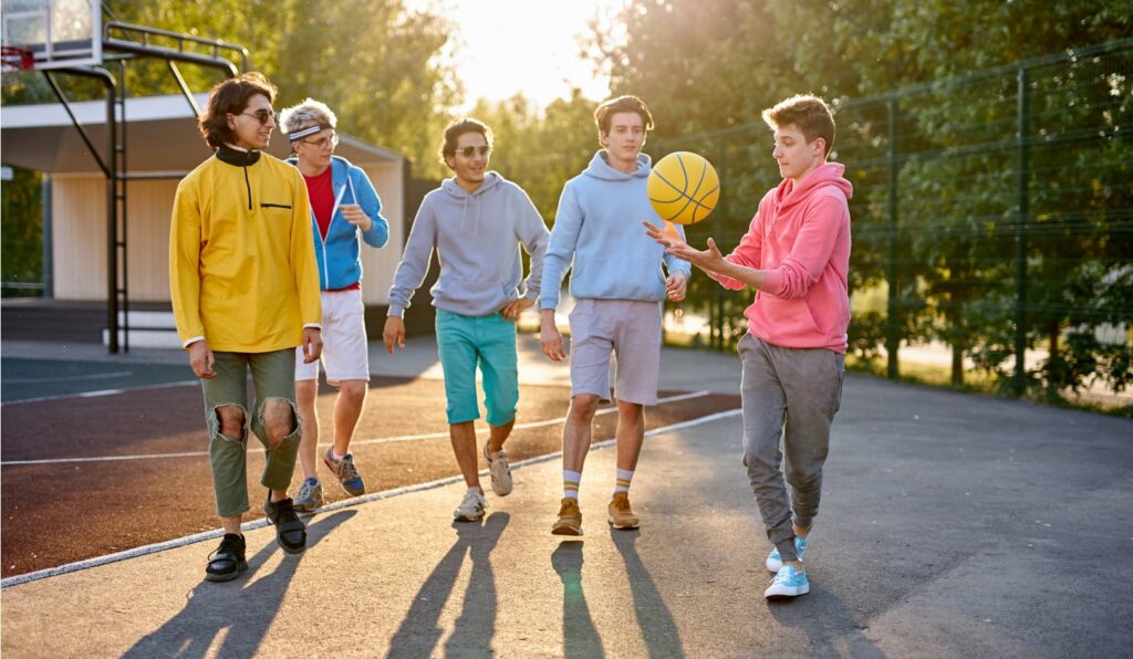 A group of children playing basket ball