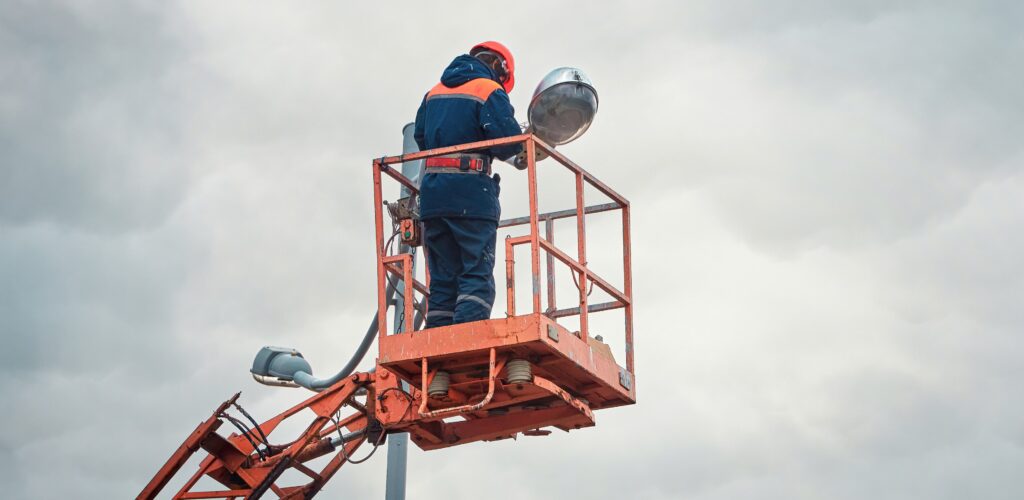 An electrical engineer working on a street light